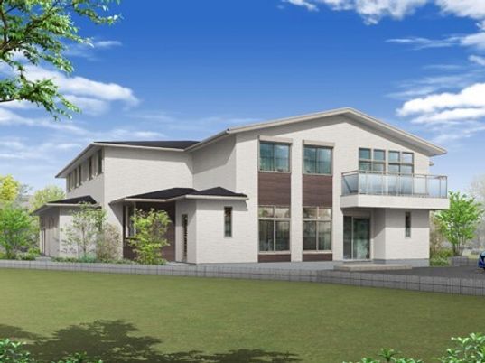 白を基調とした2階建ての建物は緑の多い日当たりのいい場所に建っている。2階部分にはテラスがあり、窓もたくさんある。