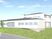 白い外観の施設建物