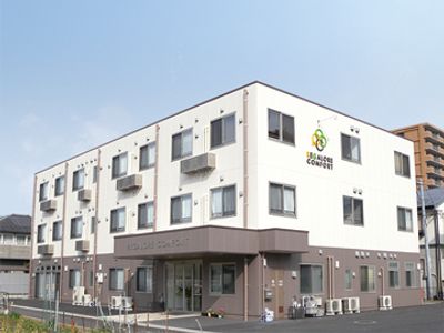 白と茶色のモダンな外観