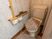 手すり付きトイレの一角